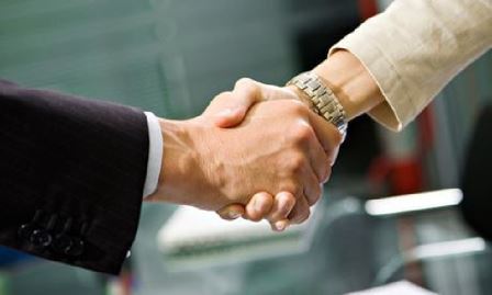 man and woman shaking hands